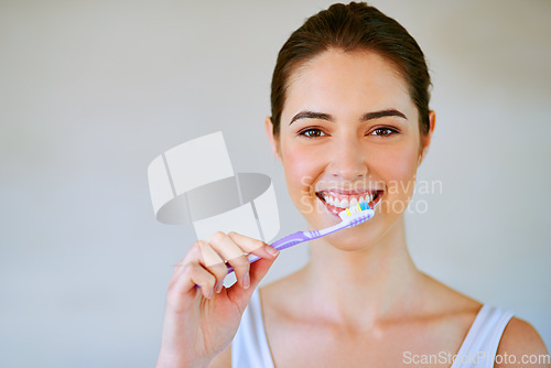 Image of Woman, toothbrush and toothpaste brushing teeth in bathroom for health, happiness and wellness in morning. Girl, portrait or cleaning mouth for healthcare, dental care and oral hygiene in home mockup