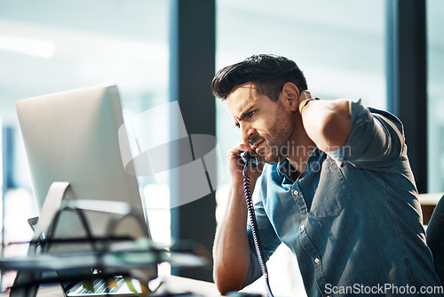Image of Business man, telephone call and stress in office for mistake, problem and anxiety for failure, bad news and crisis at computer. Frustrated worker, worry and talking on phone with fatigue of burnout