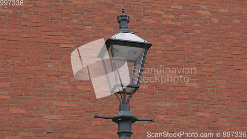 Image of lantern on a background of ancient brick walls of the Kremlin