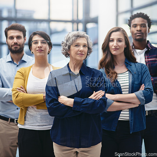 Image of Team, leadership and portrait of business people with crossed arms in the office with confidence. Happy, collaboration and group of multiracial corporate employees with female manager in workplace.