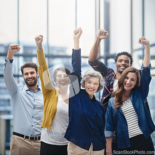 Image of Celebration, portrait and business team with fist in office for confidence, motivation and teamwork. Happy, success and group of multiracial corporate employees to celebrate achievement in workplace.