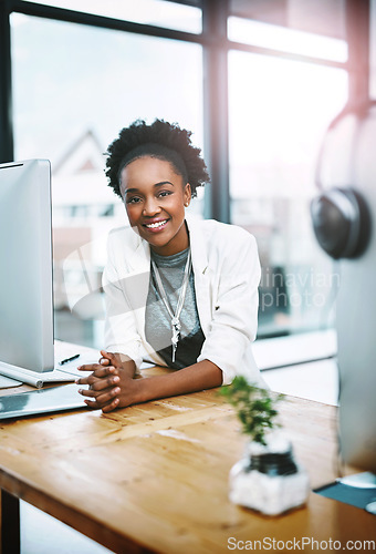 Image of Employee, portrait and black woman with a smile, office and computer with development, career and professional. Face, female person and consultant with startup success, technology and confidence