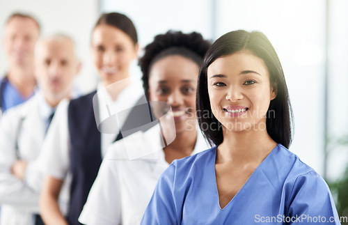 Image of Smile, team and portrait of doctors and nurses in hospital, support and teamwork in healthcare. Health, help and medicine, confident woman doctor and group of happy medical employees in row together.