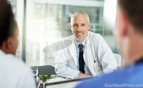 Image of Portrait, man and doctor with team in office for meeting, clinic collaboration and leadership of medical partnership. Happy healthcare worker, manager and expert consulting with employees in hospital