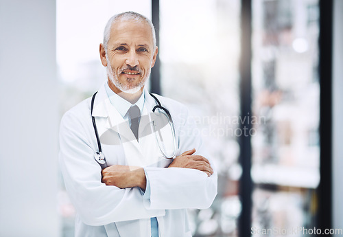 Image of Healthcare, confidence and portrait of senior doctor with pride in hospital for support in clinic. Health care boss, happiness and medicine, confident and happy man, medical professional with smile.