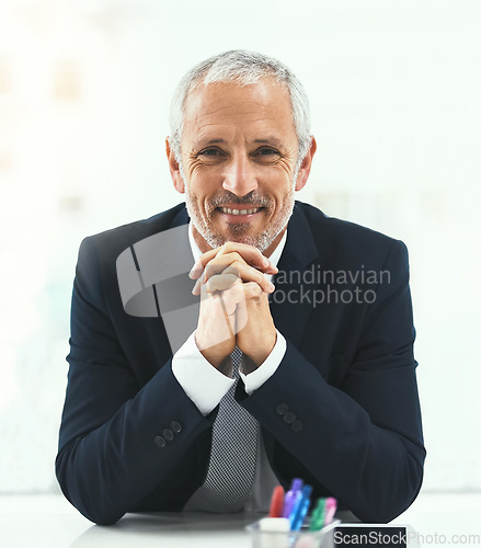 Image of Smile, portrait and senior man in office happy, confident and empowered on white background. Face, confidence and elderly male CEO cheerful at desk, proud and satisfied with his corporate career