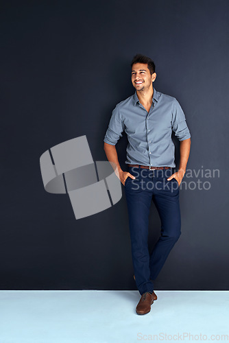 Image of Happy, fashion and space with business man in studio for professional, mission and mockup. Pride, mindset and expert with male employee on dark background for entrepreneur, happiness and style