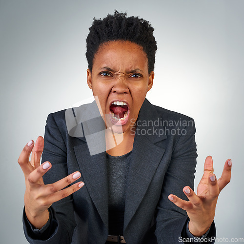 Image of Anger, frustrated and portrait of black woman in studio for screaming, problem and crazy. Mental health, rage and angry with face of female model on gray background for shouting, stress and upset