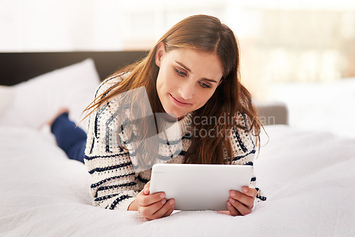 Image of Relax, smile and tablet with woman on bed for social media, communication and digital. Internet, technology and website with female person reading online at home for ebook, streaming and happiness