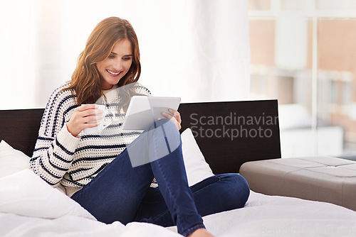 Image of Relax, coffee and tablet with woman on bed for social media, communication and digital. Internet, technology and website with female person reading online at home for ebook, streaming and happiness