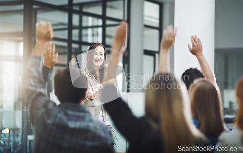 Image of Happy audience, questions and business people at seminar, presentation and workshop in office. Woman, speaker and asking feedback from crowd of employees with hands raised at conference of convention