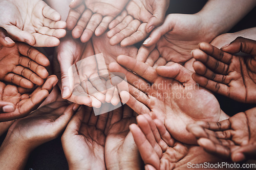 Image of Open hands, diversity and palm together with community, solidarity and support. Above, faith or charity help gesture with people, collaboration and crowd or society union or global poverty commitment