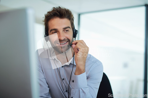 Image of Call center, employee and man with telemarketing, customer service and conversation for advice. Male person, consultant and happy agent with headphones, communication and consulting with tech support