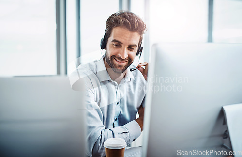 Image of Call center, employee and man with telemarketing, customer service or communication in the workplace. Male person, consultant or agent with headphones, help and advice with tech support or consulting