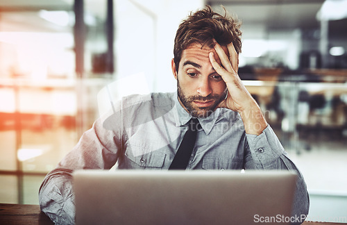 Image of Businessman, laptop and headache in stress, burnout or overworked from strain at the office desk. Frustrated man person or employee with bad head pain or confused working on computer at the workplace