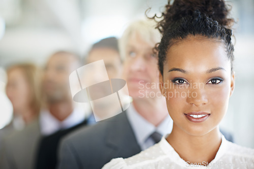 Image of Business woman, face and portrait of leader in management, leadership or diversity at the office. Corporate female person or boss in diverse group, team with unity for company growth at workplace