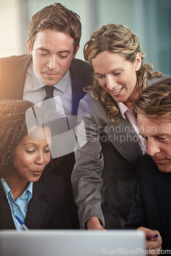 Image of Laptop, meeting and problem solving with a business team planning in the workplace of a professional office. Teamwork, collaboration and computer with an employee group working together on a project