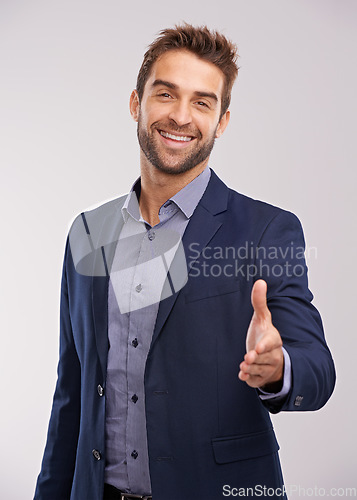 Image of Business man in portrait, smile and shaking hands with agreement and hiring on studio background. Corporate deal, recruit with thank you or welcome handshake with collaboration and professional male