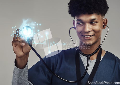 Image of Happy man, doctor and stethoscope for futuristic healthcare, cardiology or heart rate. Male medical professional with smile checking cardiovascular, rhythm or sound against a grey studio background