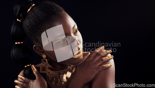 Image of Beauty, glitter and black woman in studio for makeup, art and confidence on black background. Face, creative and African female model pose with jewelry for wealth, royal and luxury gold aesthetic