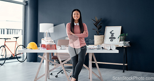 Image of Asian, woman and portrait of architect with arms crossed in office with engineering, plan and blueprint. Face, female worker in professional architecture company workplace with confidence and smile