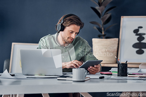 Image of Music headphones, tablet and business man in office streaming radio podcast. Technology, professional and male person listening to audio, sound or song, online browsing or social media, email and app