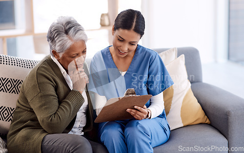 Image of Healthcare, documents and a nurse talking to an old woman patient in a nursing home for treatment. Medical, retirement and insurance with a female medicine professional speaking to mature client