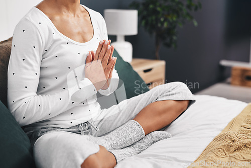 Image of Woman, hands closeup and meditation exercise in home bedroom for peace, mental health and calm chakra. Female person with praying or meditate for spiritual healing, zen and holistic yoga to relax