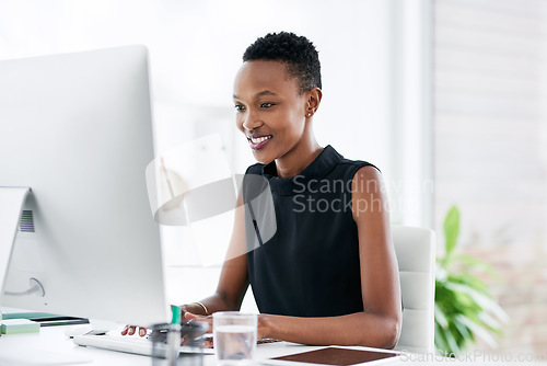 Image of Business, computer and happy black woman in office, smile and typing email on light background. Research, creative and African lady graphic designer online for planning, homepage and idea inspiration