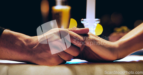 Image of Holding hands, candle and couple on dinner date at restaurant, hotel or love on marriage anniversary celebration. Man, woman and fine dining together, trust and romance at night with hand closeup