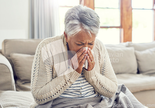 Image of Senior woman, sick and blowing nose at home from virus, allergy and illness on couch. Tired, tissue and elderly female person in a house lounge with sneeze from covid and flu on a sofa with allergies