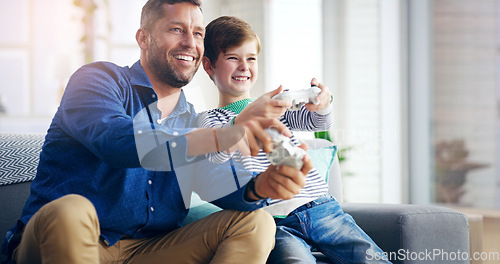 Image of Father, child and video game on home sofa while happy and excited for challenge and quality time. A man and son or kid together on a couch to play games with a joystick in a family house to relax