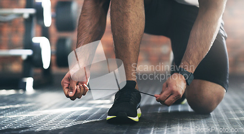 Image of Closeup, exercise and man tie shoes, fitness and start workout with training, wellness and healthy lifestyle. Zoom, male person or athlete with laces, sneakers and prepare for practice or performance