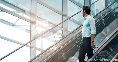 Image of Airport, travel and a business man on escalator with his luggage for a trip abroad or overseas. Corporate, global and suitcase with a male employee in a terminal for an international work flight