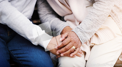 Image of Holding hands, senior couple and support while together for empathy, love and care in marriage. Closeup of elderly man and woman with hope, respect and communication or kindness outdoor in retirement