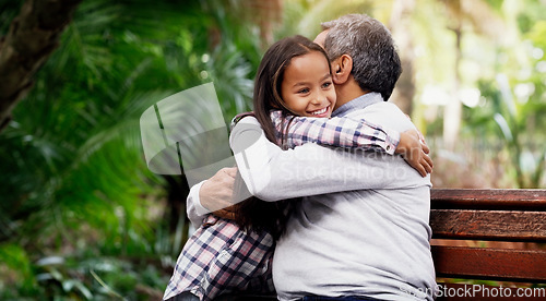 Image of Hug, girl and grandfather in a park, love and happiness on a break, loving and bonding together. Happy, granddad or female grandchild embrace, outdoor and cheerful with a smile and relax in a garden