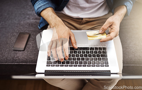 Image of Top view, hands and laptop with credit card, man and typing for online shopping, cybersecurity and payment. Man, computer and fintech on internet for discount, sale or deal with password for banking