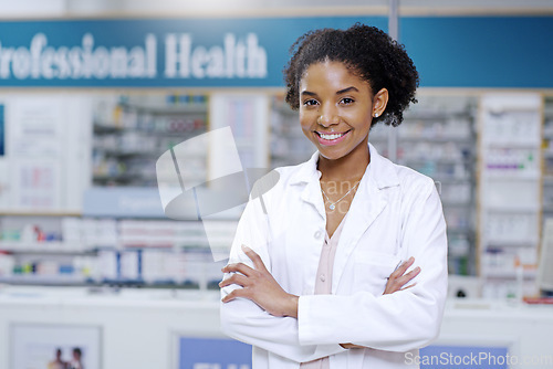 Image of Happy, arms crossed and portrait of black woman in pharmacy for medical, pills and retail. Medicine. healthcare and trust with pharmacist in drug store for product, wellness and expert advice