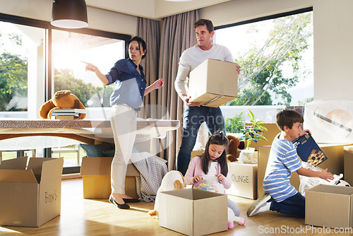 Image of Moving, box and help with family in new house for property, investment and renting. Future, teamwork and real estate with parents and children in living room of home for relocation and homeowner