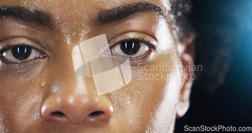 Image of Eyes, fitness and portrait of woman with sweat on dark background for workout, exercise and training. Health, wellness and face zoom of female person with dedication, motivation and focus for sports