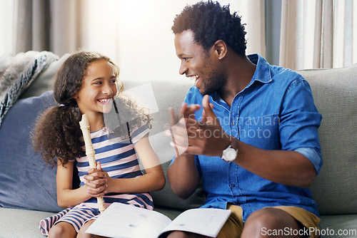 Image of Learning, music and flute with father and daughter for bonding, education and helping. Love, happy and smile with man and young girl in family home for child development, recorder and instrument