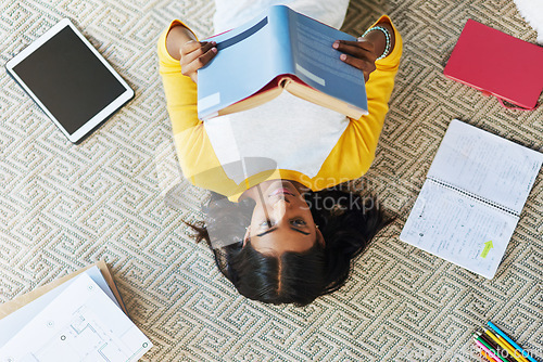 Image of Student books, top view floor and woman reading info, school research or knowledge for college education. Learning, university scholarship study and gen z person studying, relax and lying at home