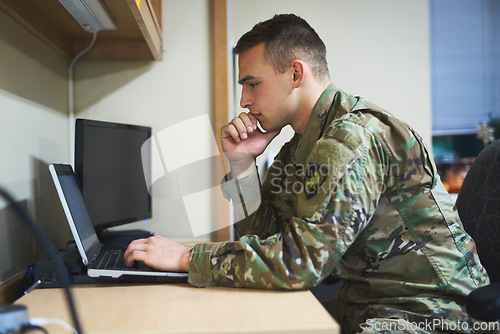 Image of Laptop, thinking and military man with security software, online research and law academy in office. Planning, soldier or young army person on computer, internet search or website information check