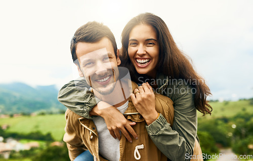 Image of Happy, love and piggyback with portrait of couple in nature for happy, smile and bonding. Happiness, relax and care with face of man carrying woman on countryside date for spring, vacation in Brazil