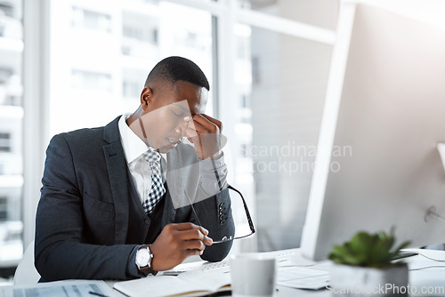 Image of Black man in business, headache and stress with burnout, depression and brain fog in office. Male person with pain at desk, migraine and tired, overworked with work crisis anxiety in the workplace