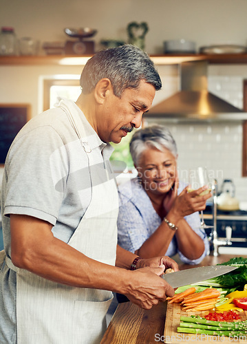 Image of Cooking, old man and happy woman with wine at kitchen counter, healthy food and marriage bonding in home. Drink, glass and vegetables, senior couple with happiness vegetable meal prep and retirement.