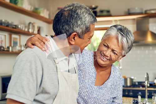 Image of Cooking, hug and old couple in kitchen with smile, healthy marriage bonding in home and helping with dinner. Happiness, help and love, senior man and woman with happy face, meal prep and retirement.