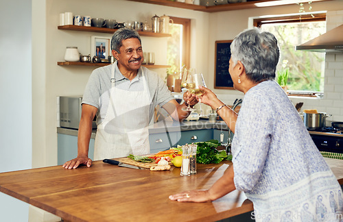 Image of Cheers, wine and old couple in kitchen, cooking healthy food together with smile, diet and health. Toast, senior woman and man with drinks in glass, meal prep and happiness with love in retirement.