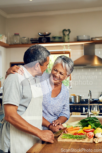 Image of Love, vegetables and old man with happy woman at kitchen counter, embrace and healthy marriage bonding in home. Happiness, help and cooking, senior couple with smile, hug and dinner in retirement.