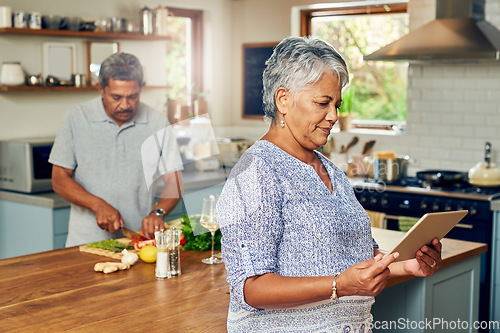 Image of Old woman in kitchen with man, tablet and cooking healthy food together in home with nutrition. Digital recipe, smile and senior couple in house with meal prep, happiness and wellness in retirement.